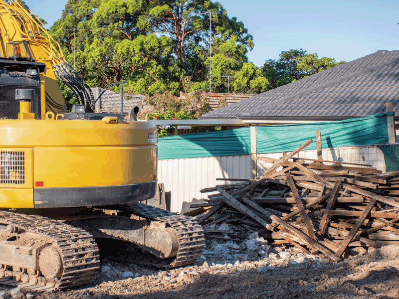 excavator by construction and demolition debris