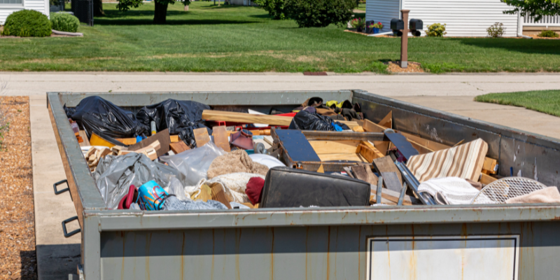 dumpster with junk